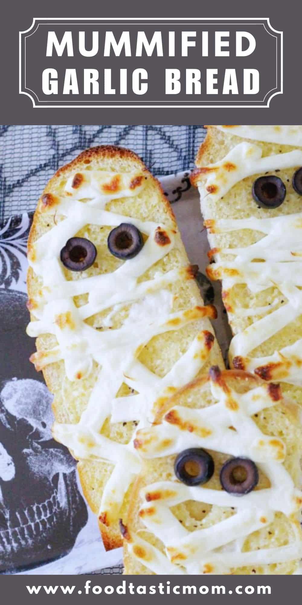 This Mummified Garlic Bread is a tasty and super simple way to dress up your dinner table for Halloween. via @foodtasticmom