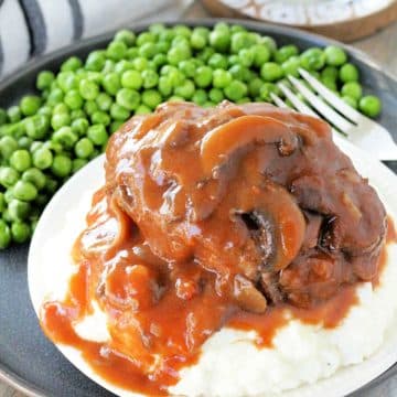 Salisbury steak and mashed potatoes is ultimate meat and potatoes comfort food. Made with lean ground beef and smothered with mushroom gravy.