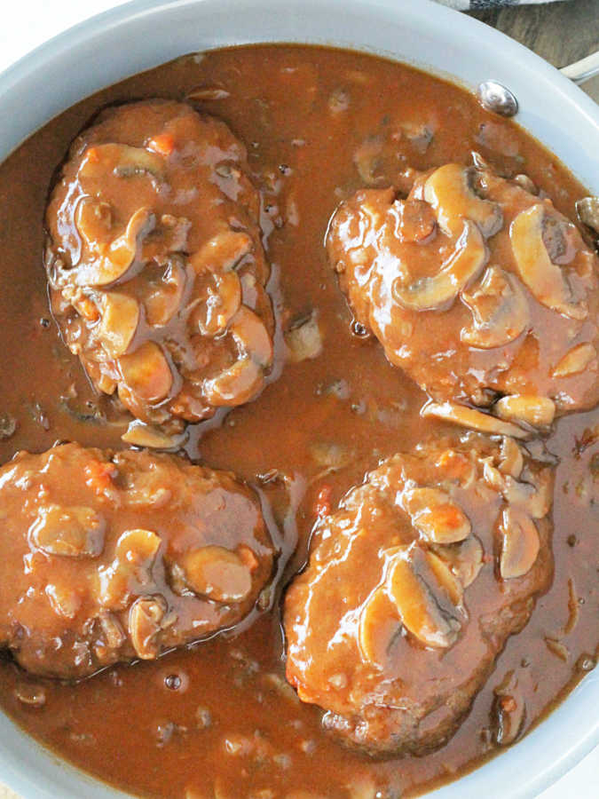 cooked salisbury steak and gravy in the skillet