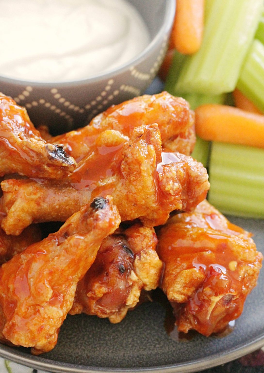 Crispy Baked Chicken Wings - with the best buffalo sauce - Foodtastic Mom