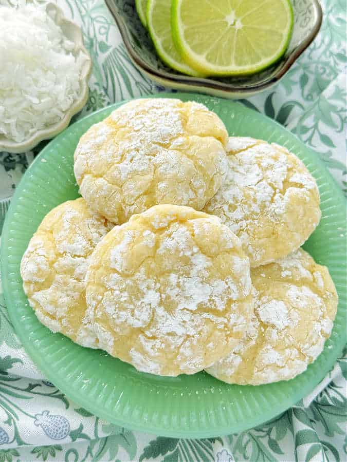 a plate of five coconut key lime crinkle cookies ready to serve