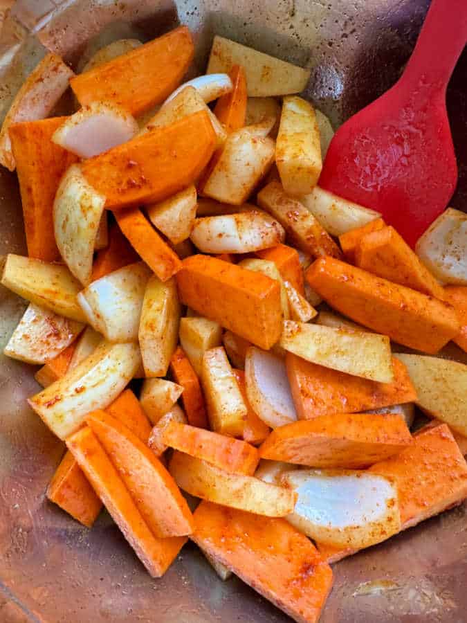 sliced potatoes and onions ready to be roasted