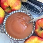 a bowl of cinnamon applesauce from the crockpot, ready to eat