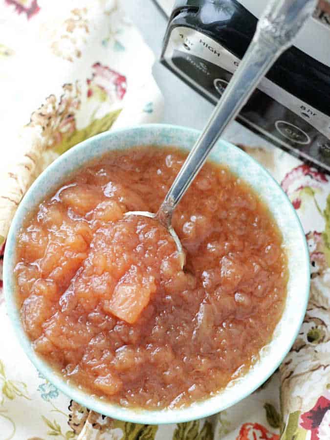 crockpot applesauce using a potato masher for a chunky, rustic texture