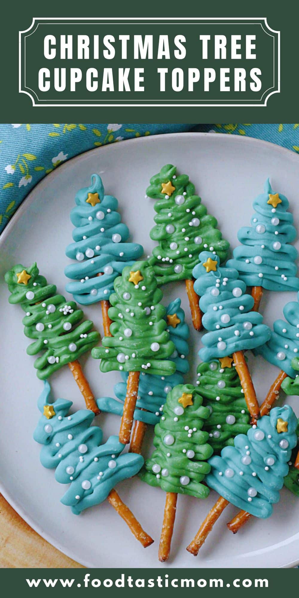 These Christmas Tree Cupcake Toppers are a simple and festive way to decorate a dozen cupcakes for the holidays. Made with pretzel sticks, candy melts and sprinkles. via @foodtasticmom