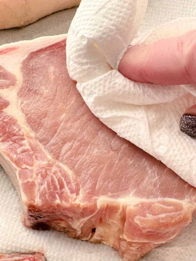 drying the pork chops with paper towel before broiling