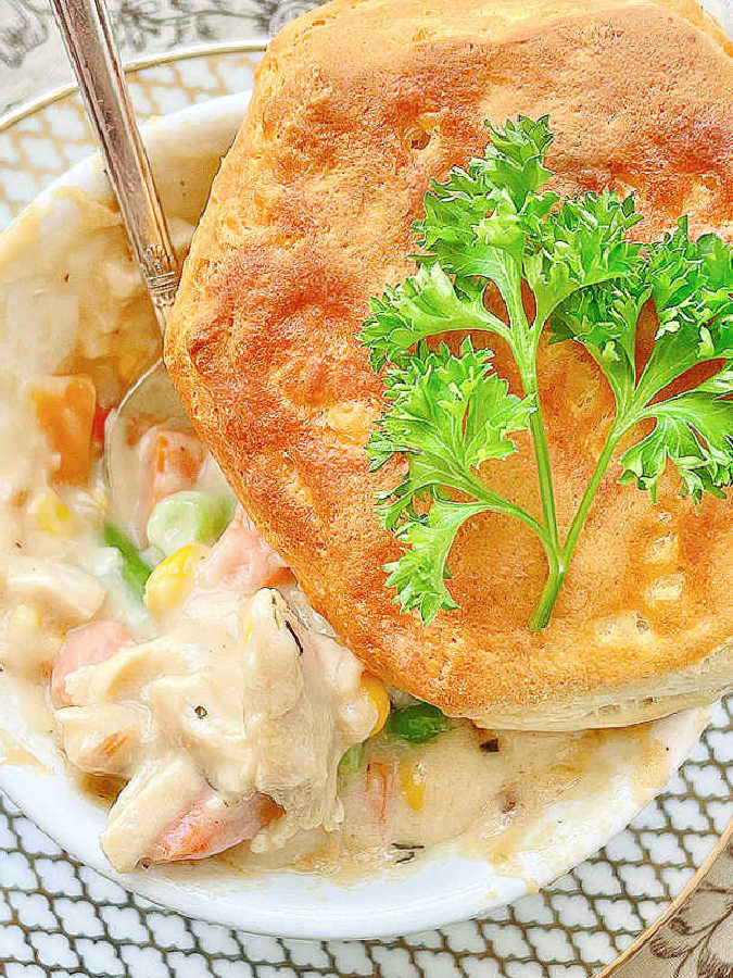 showing the filling underneath the biscuit of an air fryer chicken pot pie