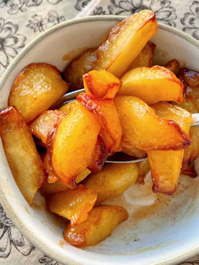 taking a bite of air fryer apples