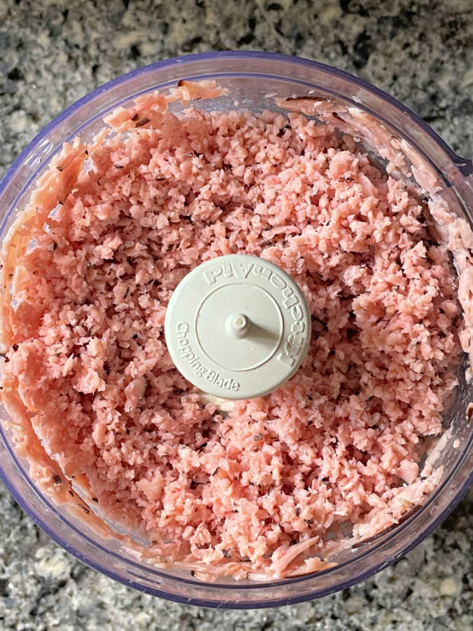 ham chopped up in the bowl of a food processor