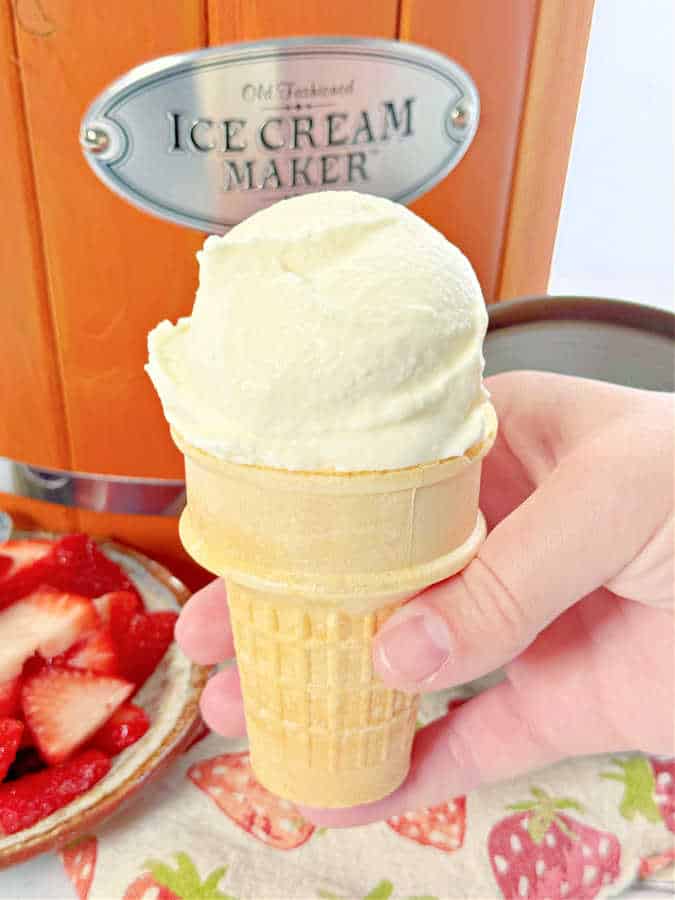 a scoop of homemade vanilla ice cream on a cake cone