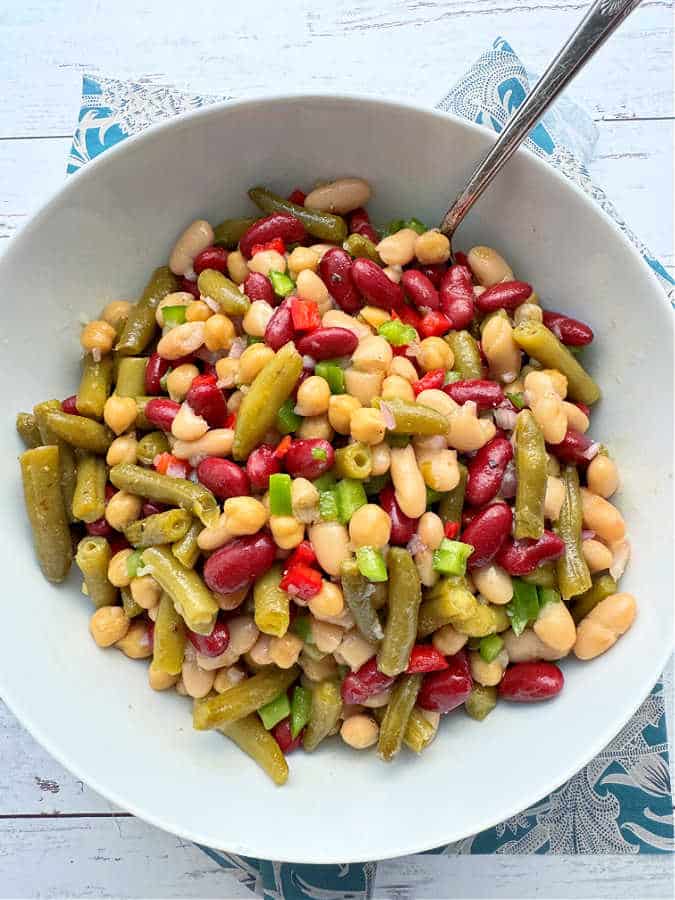 a huge bowl of four bean salad ready to serve