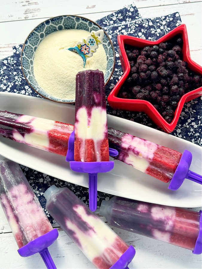 a display of all the red white and blue collagen popsicles, three ready to eat and three still in the popsicle molds