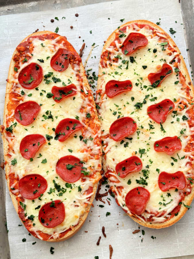 two freshly baked pepperoni pizza boats