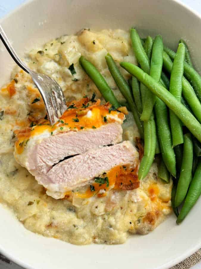 showing a baked pork chop cut in half