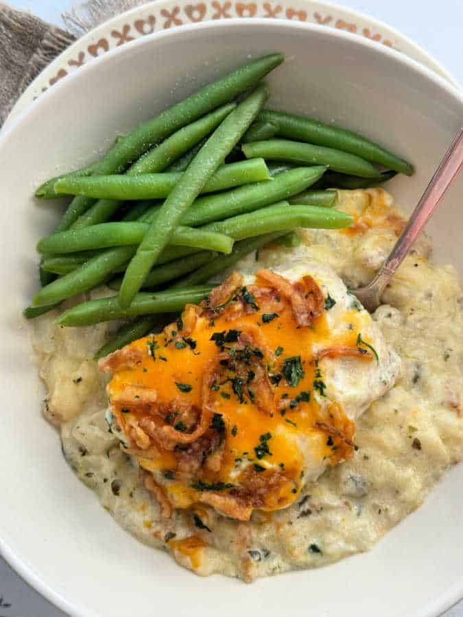 pork chop casserole plated with fresh green beans