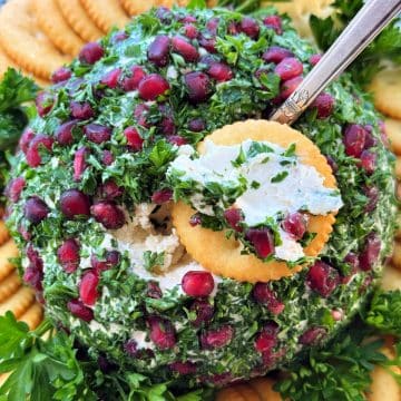 Christmas cheese ball spread on a Ritz cracker