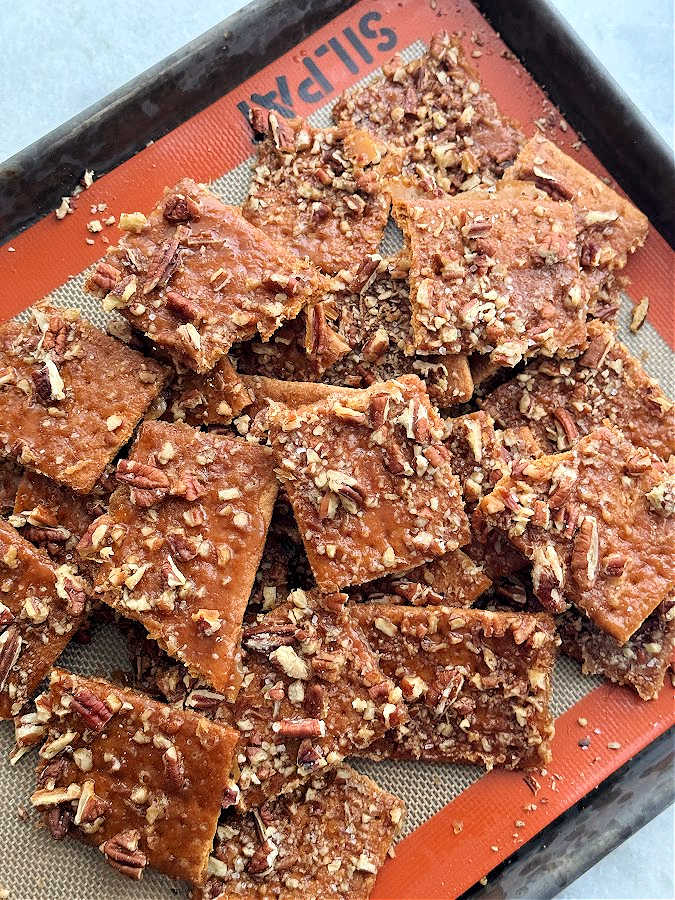 a pile of praline graham squares ready to serve on a baking sheet