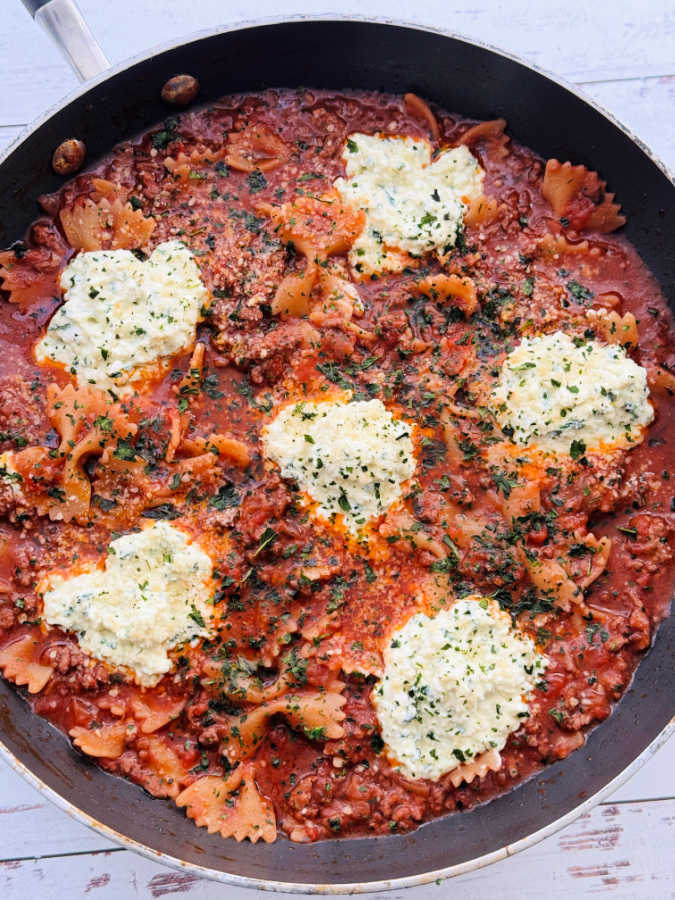 a skillet full of easy one pot beef lasagna