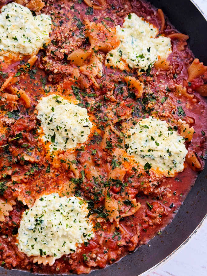 a close up view of one pot lasagna, ready to serve from the skillet